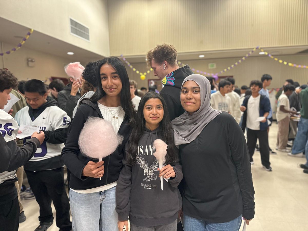 Eshal Turabi('28), Mugdha Deshpande ('28), Aleena Khan ('28), received free cotton candy—a popular treat in Japan— after completing their stamp sheets. 