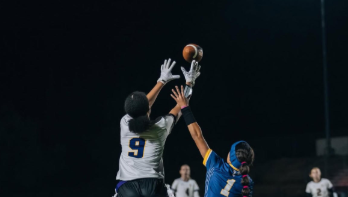 Kalani Walker ('26) catches a pass, securing a first an ten for the Dons.