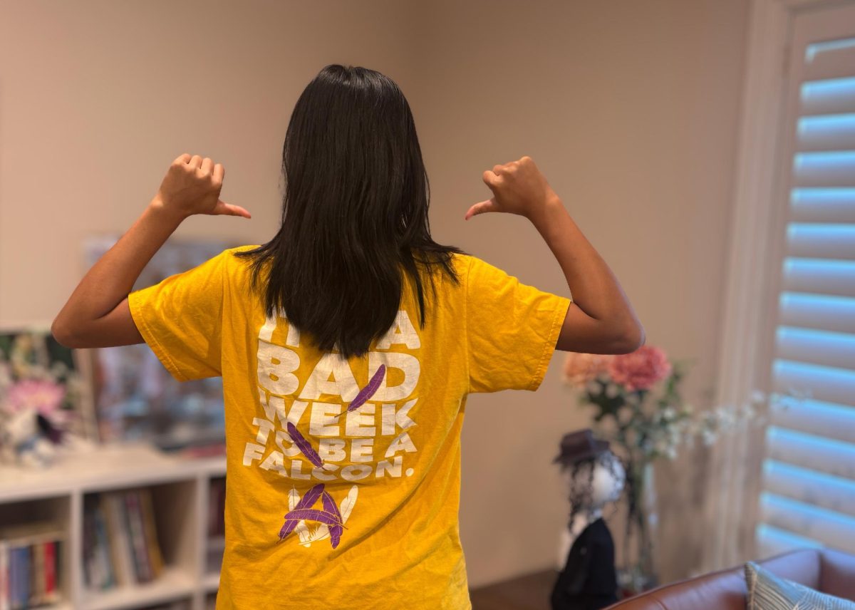 A student shows off their Amador rivalry shirt from a previous year