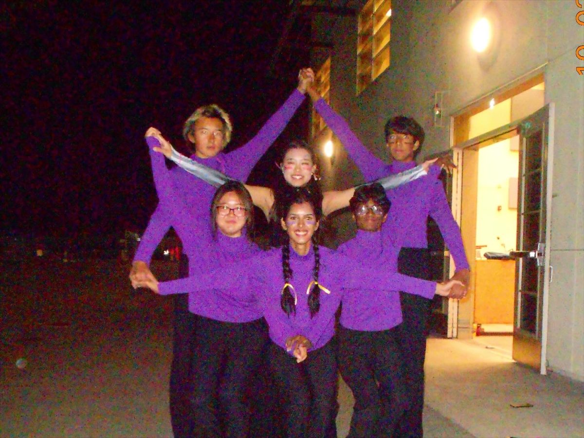 Band Council officers Edward Kazmierski ('26), Ritwik Aeka ('26), Celicia Thendean ('26), Kari Song ('27), Guhan Palvadi ('27), and Seera Kaur ('26) pose for picture after a football game. 