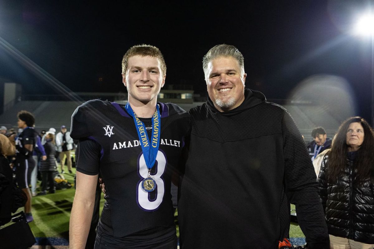 Bryan and McKay Kenitzer pose after McKay's game. Photo credit: McKay Kenitzer.