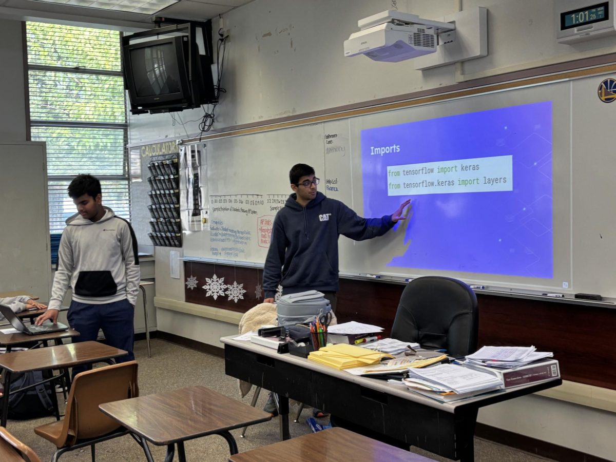 AI Club officers Sid Shah ('26) and Srijon Mandal ('26) begin their lesson on implementing AI into coding.