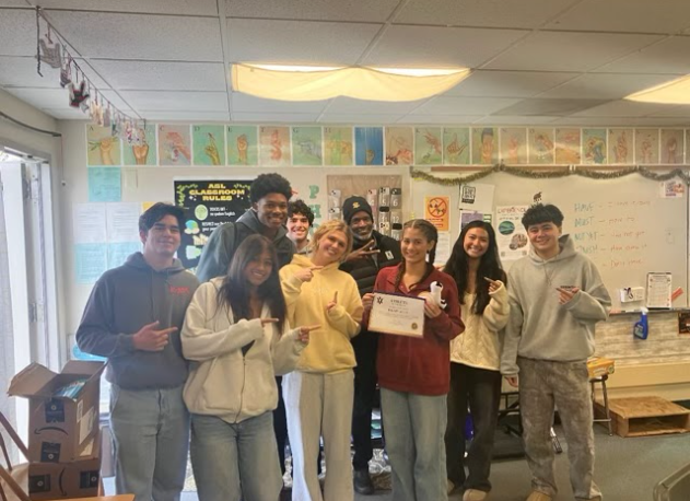 Ellary Allen ('27) received her Athlete of the Month Award, accompanied by a certificate, bagels, and other inclusions.