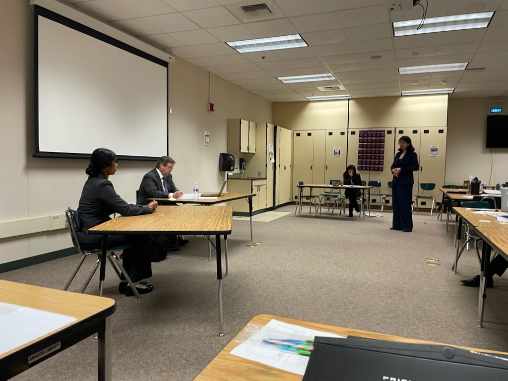 Mock Trial judges await for the scrimmage to begin as students practice their oration.
