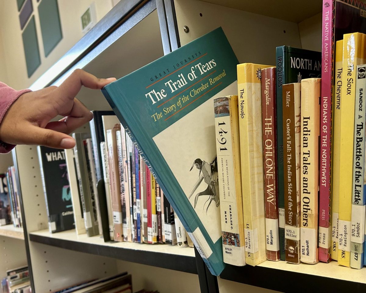 In the school library's shelf labeled 951.01-973.7CA, students can find the Native American section. Here, the shelf is filled with books on the cultures, events through history, and even mythology of Indigenous tribes.