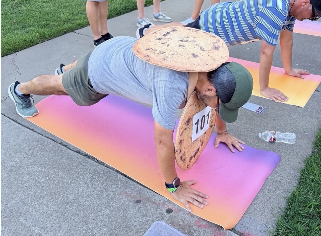 Teams participated in multiple challenges, one of which is a 90 second plank after solving a clue to head back to the AV office.