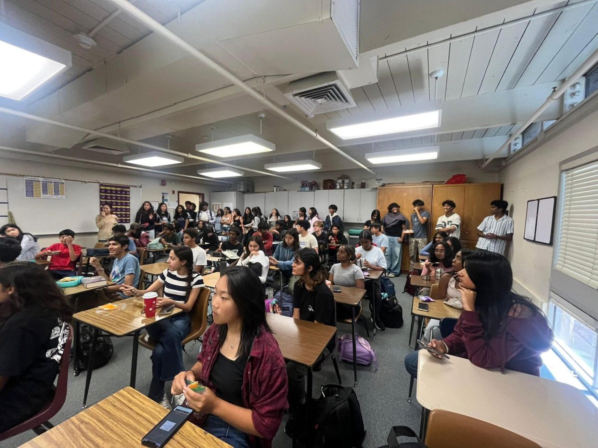 Students gather for club meeting. 