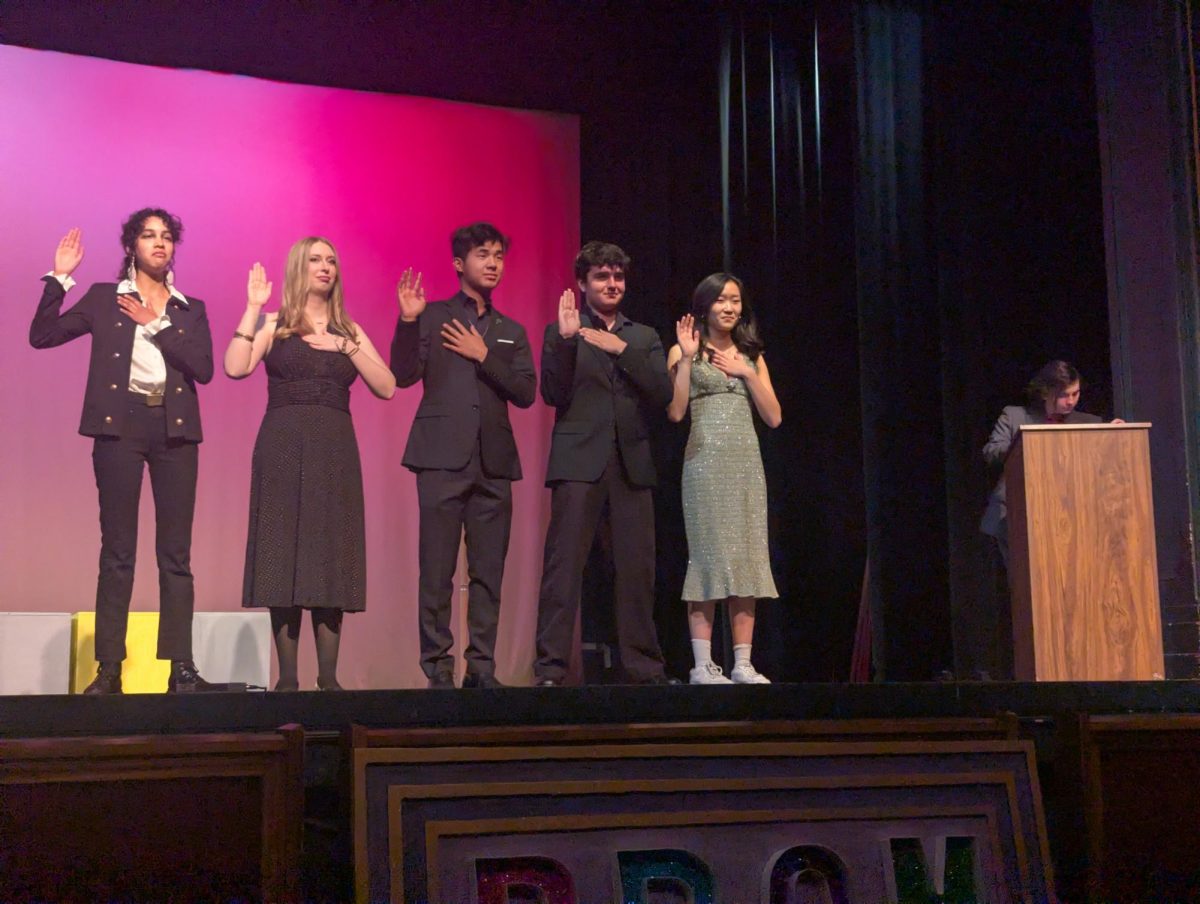 Next year's Amador Drama Club Officers recite a chant pledging their loyalty to the program at the Drama Awards.
